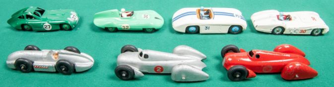 7 Dinky Toys. Cunningham C-5R in white with blue stripes, mid blue wheels, RN31, with light brown