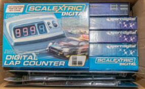 A large quantity of Scalextric track packs and accessories. Includes Scalextric digital lap counter,