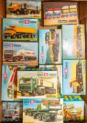 13 Kibri HO scale model kits. Mainly lorries and construction vehicles. Including mostly