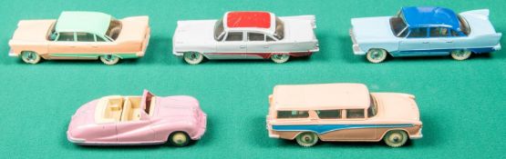 5 Dinky Toys Cars. An Austin Atlantic in pink with cream wheels. 2 Plymouth Plaza, one in two tone