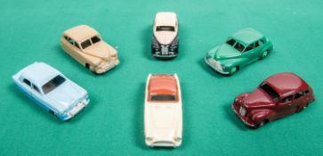6 Dinky Toys. Austin Somerset in cream and black, with cream wheels. Morris Oxford in dark green,