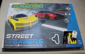 Scalextric street racers 1:32 scale. Set contains a yellow Rasio C-20 and a red Pagani Huayra