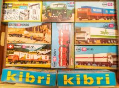 10 Kibri HO scale model kit. Mainly lorries or construction vehicles, including a DAF artic with