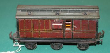 A rare O gauge Carette Clemenson 6 wheeled clearstory Guards Van. in lined maroon Midland Railway