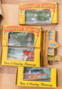 5 Lone star Gulliver Country OOO scale buildings. 4 are boxed and look unused and a loose church.