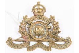 WWI Canadian CEF 52nd Overseas Field Battery Canadian Field Artillery cap badge, with two