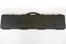A foam lined rigid plastic gun case, 50" x 11" internal, the lid embossed with scene of stags in