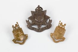 "Kitchener's Army" bronze cap badge with lugs of the 13th (Wandsworth) Bn The East Surrey Regt,