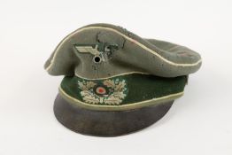 A Third Reich Army officer's peaked "crusher" cap, with woven eagle and cockade, soft peak, white