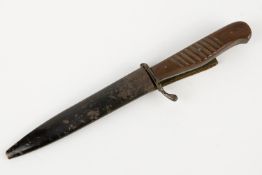 A WWI German trench dagger Nahkampfmesser, the 4¾" blade shortened and ground, with blackened iron