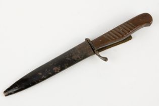 A WWI German trench dagger Nahkampfmesser, the 4¾" blade shortened and ground, with blackened iron