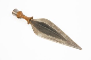 An African Kusu knife, broad leaf shaped blade 11", the hilt with copper covered grip and