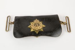 A post 1902 Army Service Corps officer's leather cross belt pouch, with brass badge and fittings. GC