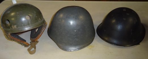 A WWII US Tank crew helmet, olive drab finish worn; A Danish steel helmet and a British 1960s