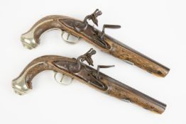A pair of 20 bore flintlock holster pistols, 12½" overall, barrels 7¼" with faint hints of silver