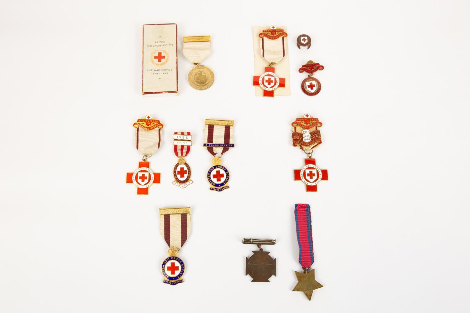 A small collection of Nursing related medals and badges: British Red Cross War Service 1914-18, EF
