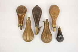 Four gun size embossed copper powder flasks, "fluted", GC (spring broken); "panel", basically GC (
