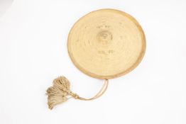 A Somali thick hide shield, 13" diameter, with turned over dish rim, raised central boss, concentric