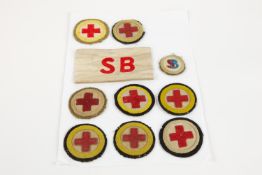 10 British army WW1 medical badges. 8 x red cross in circle, stretcher bearer armband plus stretcher