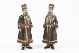 Two speculative Russian painted bronze figures, inscribed "Faberge" and dated 1912, height 7".