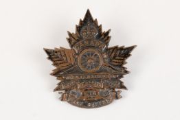 WWI CEF cap badge of the 5th Overseas Siege Battery Canadian Heavy Artillery, with two