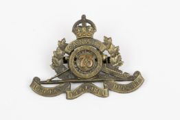 WWI CEF cap badge of the 73rd Overseas Field Battery Canadian Field Artillery, with 2 brass