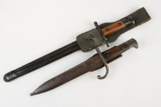 An Italian M1891/97 Carcano Truppi Speciali bayonet, with pale wood grips and black lacquered finish