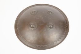 An Indian plain iron shield, "dhal", 14" diameter, with decorative applied rim, 4 bosses, and
