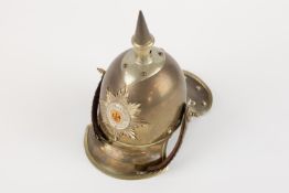 A miniature Imperial German Garde Cuirassier metal helmet, of correct colour metal with white
