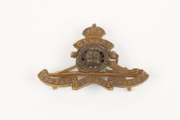 WWI CEF cap badge of the 69th Overseas Field Battery Canadian Field Artillery, with three brass