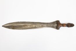 An African Bena Lulua or Kuba knife, blade 19½" with partly serrated edges, and with one piece