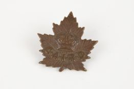 A WWI CEF cap badge of the Canadian Arms Inspection Repair Depot. GC £100-150
