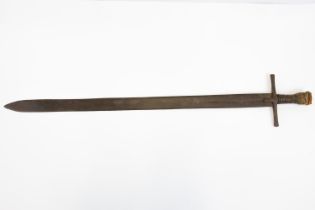 A Sudanese sword, kaskara, heavy flat blade 34½", the hilt with plain cruciform iron cross piece,