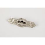 A Third Reich U boat clasp in silver, by Schwerin, Berlin, with ribbed pin and rough finish to the