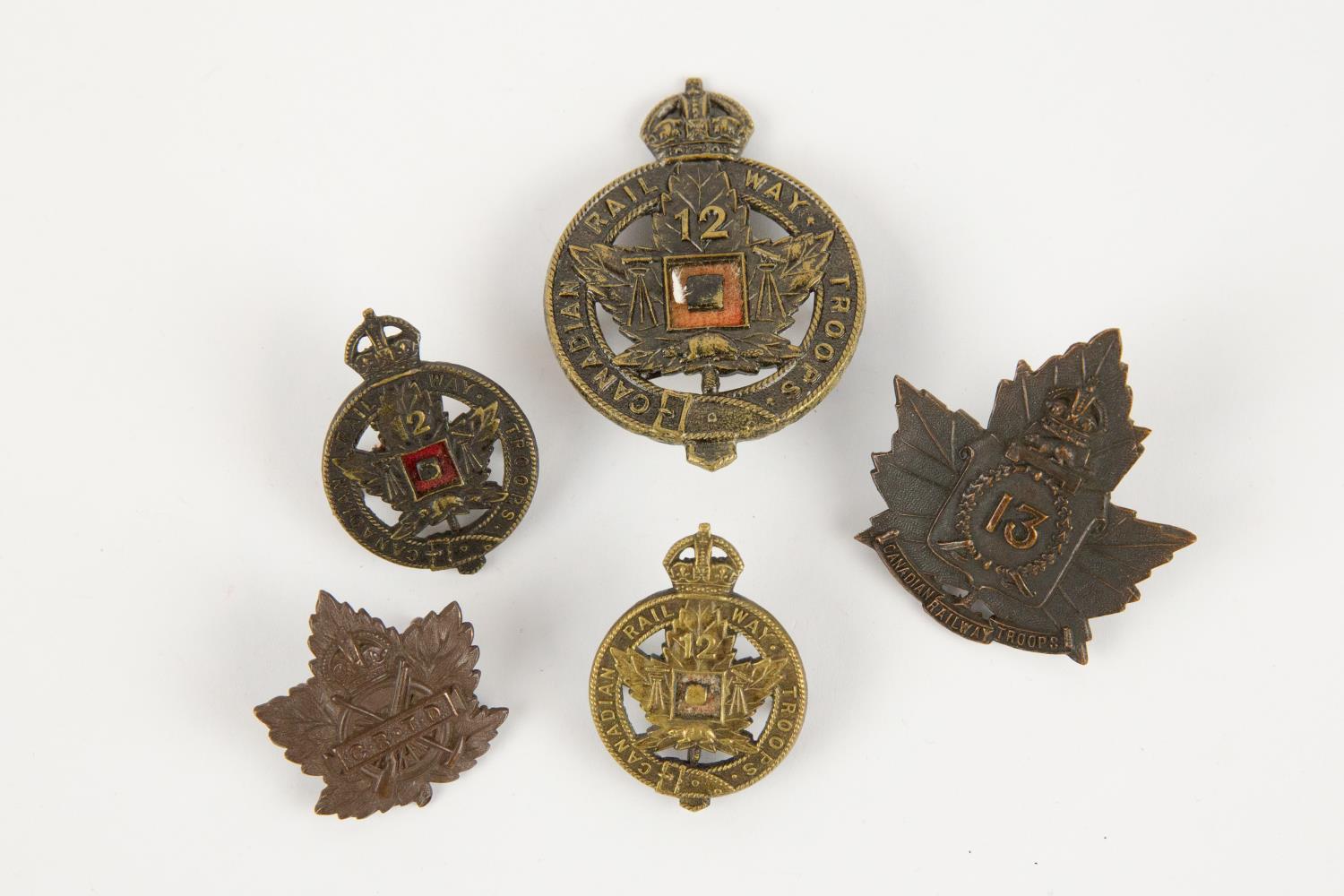WWI CEF Railway Troops badges: 12th Bn cap badge and pair of collar badges, all by Gaunt, 13th Bn