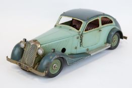 A rare original 1930's Marklin clockwork Adler Streamlined limousine (1101c). In two tone green,