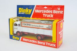 A scarce Dinky Toys Mercedes Benz Truck (940). A promotional example in white, red and grey FISONS