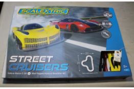Scalextric street racers 1:32 scale. Set contains a yellow Rasio C-20 and a red Pagani Huayra