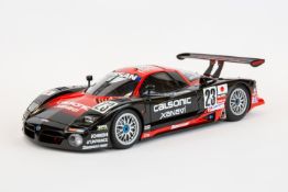 A 1:18 Autoart Signature series Nissan R390 GT1 #23 Le Mans 1997. In black and red racing livery,