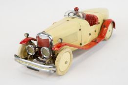 A rare 1930's No.2 Meccano Constructor Car. A boat tail example in cream with red mudguards/