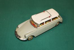 A scarce early 1960's SFTF tinplate 1:24 scale friction powered model of a Citroen ID19 DS Safari.