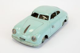 A scarce JNF prototyp Porsche, tin plate clockwork model car in light blue. Made in Germany US zone,