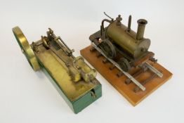 A horizontal single cylinder steam engine. Of mostly brass construction, fitted with a 13.5cm