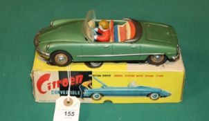 A scarce early 1960's SFTF tinplate 1:24 scale friction powered model of a Citroen ID19 DS 4-door