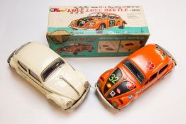 2 1970's Japanese TAIYO battery powered Volkswagen Beetles. Approximately 1:18 scale, one finished