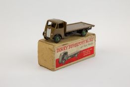 Dinky Supertoys Guy Flat Truck (512). A scarce very early example in khaki cab and flatbed with