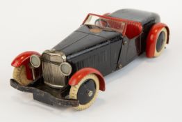A scarce 1930's No.1 Meccano Constructor Car. An example in black with red mudguards, red seats,