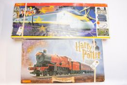 A quantity of OO railway by various makes. 2 Hornby sets. A Harry Potter Hogwarts Express,