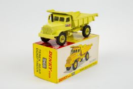 Dinky Toys TEREX Rear Dump Truck (965). In pale yellow livery, with window glazing, with one TEREX