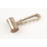 A nickel plated copper bone hammer from a military surgeon's kit, stamped with a broad arrow and "